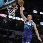 
              Charlotte Hornets center Mason Plumlee dunks the ball against the Cleveland Cavaliers during the first half of an NBA basketball game in Charlotte, N.C., Friday, Feb. 4, 2022. (AP Photo/Jacob Kupferman)
            