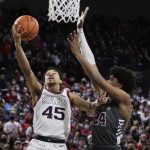 
              Gonzaga guard Rasir Bolton (45) shoots while defended by Santa Clara guard Jalen Williams (24) during the first half of an NCAA college basketball game Saturday, Feb. 19, 2022, in Spokane, Wash. (AP Photo/Young Kwak)
            