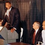 
              FILE - Earvin "Magic ' Johnson speaks during a press conference to announce his retirement from Los Angeles Lakers while former teammate Kareem Abdul Jabbar, right, and NBA Commissioner David Stern, looks on Nov. 7, 1991, in Inglewood, Calif. Johnson stunned the NBA and those watching his news conference live on TV by announcing he had tested positive for HIV and would be retiring from the Los Angeles Lakers. (AP Photo / Mark J. Terrill, File)
            