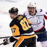 
              Pittsburgh Penguins' Sidney Crosby (87) and Washington Capitals' Alex Ovechkin take a face-off during the third period of an NHL hockey game in Pittsburgh, Tuesday, Feb. 1, 2022. The Capitals won in overtime 4-3. (AP Photo/Gene J. Puskar)
            