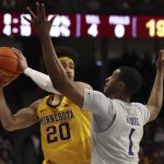 
              Minnesota guard E.J. Stephens (20) handles the ball against Northwestern guard Chase Audige (1) during the first half of an NCAA college basketball game Saturday, Feb. 19, 2022, in Minneapolis. (AP Photo/Stacy Bengs)
            