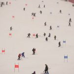 
              Workers clear snow from the course after the second run of the men's giant slalom was delayed due to a heavy snowfall at the 2022 Winter Olympics, Sunday, Feb. 13, 2022, in the Yanqing district of Beijing. (AP Photo/Robert F. Bukaty)
            