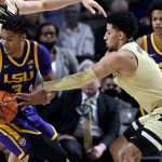 
              Vanderbilt guard Scotty Pippen Jr. (2) attempts to steal the ball from LSU forward Alex Fudge (3) during the first half of an NCAA college basketball game Saturday, Feb. 5, 2022, in Nashville, Tenn. (AP Photo/Mark Zaleski)
            