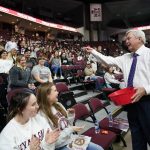 
              Texas A&M head coach Gary Blair, right, throws out candy to the crowd at Reed Arena before his final NCAA college basketball game at Reed Arena, against South Carolina,  Thursday, Feb. 24, 2022, in College Station, Texas. Blair is retiring at the end of the season. (AP Photo/Sam Craft)
            