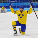 
              Sweden's Lucas Wallmark celebrates after scoring a goal against Latvia during a preliminary round men's hockey game at the 2022 Winter Olympics, Thursday, Feb. 10, 2022, in Beijing. (AP Photo/Matt Slocum)
            