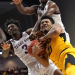 
              Missouri forward Ronnie DeGray III (21) fights for a rebound with Texas A&M guard Quenton Jackson (3) and forward Henry Coleman III (15) during the second half of an NCAA college basketball game, Saturday, Feb. 5, 2022, in College Station, Texas. (AP Photo/Sam Craft)
            