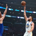 
              Golden State Warriors guard Stephen Curry shoots as Los Angeles Clippers forward Nicolas Batum defends during the first half of an NBA basketball game Monday, Feb. 14, 2022, in Los Angeles. (AP Photo/Mark J. Terrill)
            