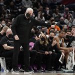 
              San Antonio Spurs head coach Gregg Popovich gestures during the first half of an NBA basketball game against the Washington Wizards, Friday, Feb. 25, 2022, in Washington. (AP Photo/Luis M. Alvarez)
            