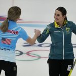 
              Tahli Gill, of Australia, right, congratulates Victoria Persinger, left, of the United States, after the United States won the mixed doubles curling match at the Beijing Winter Olympics Wednesday, Feb. 2, 2022, in Beijing. (AP Photo/Brynn Anderson)
            