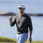 
              Patrick Cantlay holds up his ball on the fourth green of the Pebble Beach Golf Links during the final round of the AT&T Pebble Beach Pro-Am golf tournament in Pebble Beach, Calif., Sunday, Feb. 6, 2022. (AP Photo/Eric Risberg)
            