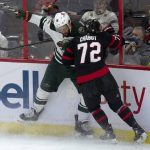 
              Minnesota Wild left wing Jordan Greenway collides with Ottawa Senators defenseman Thomas Chabot (72) along the boards during the first period of an NHL hockey game Tuesday, Feb. 22, 2022, in Ottawa, Ontario. (Adrian Wyld/The Canadian Press via AP)
            