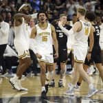 
              Providence's Nate Watson (0), Justin Minaya (15), and Noah Horchler (14) celebrate a triple overtime win following an NCAA college basketball game against Xavier Wednesday, Feb. 23, 2022, in Providence, R.I. (AP Photo/Stew Milne)
            