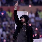 
              Eminem performs during halftime of the NFL Super Bowl 56 football game between the Los Angeles Rams and the Cincinnati Bengals, Sunday, Feb. 13, 2022, in Inglewood, Calif. (AP Photo/Elaine Thompson)
            