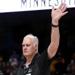 
              Jim Brewer, of the 1982 Minnesota men's basketball team, waves as the team is honored during Minnesota's NCAA college basketball game against Wisconsin on Wednesday, Feb. 23, 2022, in Minneapolis. (AP Photo/Andy Clayton-King)
            
