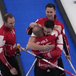 
              Team Canada celebrates after winning the men's curling bronze medal match against the United States at the Beijing Winter Olympics Friday, Feb. 18, 2022, in Beijing. (AP Photo/Nariman El-Mofty)
            