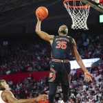 
              Auburn guard Devan Cambridge (35) goes up for a dunk during the first of an NCAA college basketball game against Georgia, Saturday, Feb. 5, 2022, in Athens, Ga. (AP Photo/John Bazemore)
            