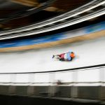 
              Axel Jungk, of Germany, slides during men's skeleton run 3 at the 2022 Winter Olympics, Friday, Feb. 11, 2022, in the Yanqing district of Beijing. (AP Photo/Pavel Golovkin)
            