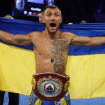 
              FILE - Vasiliy Lomachenko, of Ukraine, celebrates after defeating Guillermo Rigondeaux in a WBO junior lightweight title boxing match in New York, Dec. 9, 2017. Former heavyweight champions Vitali and Wladimir Klitschko are leading some of the resistance from the mayor's office in beleaguered Kyiv. Two-time Olympic champion Vasiliy Lomachenko has an assault rifle and a place in a defense force, and current heavyweight champion Aleksandr Usyk rushed back home to take up arms against the Russians. Ukraine's rich boxing community is determined to fight, this time with guns instead of their fists. (AP Photo/Adam Hunger, File)
            