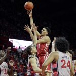 
              Wisconsin guard Johnny Davis (1) shoots over Rutgers guard Caleb McConnell during the first half of an NCAA college basketball game Saturday, Feb. 26, 2022, in Piscataway, N.J. (AP Photo/Adam Hunger)
            