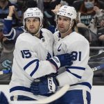 
              Toronto Maple Leafs center Alexander Kerfoot, left, and center John Tavares celebrate a goal during the first period of the team's NHL hockey game against the Seattle Kraken, Monday, Feb. 14, 2022, in Seattle. (AP Photo/Stephen Brashear)
            