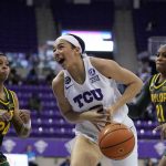 
              TCU guard Tara Manumaleuga is stripped of the ball driving to the basket by Baylor guard Ja'Mee Asberry (21) as guard Sarah Andrews (24) helps defend in the second half of an NCAA college basketball game in Fort Worth, Texas, Saturday, Feb. 19, 2022. (AP Photo/Tony Gutierrez)
            
