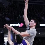 
              Purdue center Zach Edey, right, shoots against Northwestern center Ryan Young during the first half of an NCAA college basketball game in Evanston, Ill., Wednesday, Feb. 16, 2022. (AP Photo/Nam Y. Huh)
            