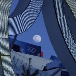 
              The moon rises over Genting Snow Park before the women's freestyle skiing aerials finals at the 2022 Winter Olympics, Monday, Feb. 14, 2022, in Zhangjiakou, China. (AP Photo/Kiichiro Sato)
            