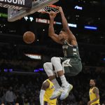 
              Milwaukee Bucks forward Giannis Antetokounmpo dunks in the first half of an NBA basketball game against the Los Angeles Lakers, Tuesday, Feb. 8, 2022, in Los Angeles. (AP Photo/John McCoy)
            