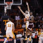 
              Texas A&M guard Quenton Jackson (3) spins while passing the ball off as he's defended by Tennessee guard Santiago Vescovi (25) during the first half of an NCAA college basketball game Tuesday, Feb. 1, 2022, in Knoxville, Tenn. (AP Photo/Wade Payne)
            