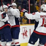 
              Washington Capitals center Joe Snively, left, celebrates with teammates after scoring a goal against the Nashville Predators during the first period of an NHL hockey game Tuesday, Feb. 15, 2022, in Nashville, Tenn. (AP Photo/Mark Zaleski)
            