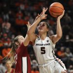 
              Oregon State's Taya Corosdale (5) drives past Stanford's Hannah Jump (33) during the second half of an NCAA college basketball game in Corvallis, Ore., Friday, Feb. 18, 2022. Stanford won 87-63. (AP Photo/Amanda Loman)
            
