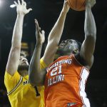 
              Michigan center Hunter Dickinson (1) blocks a shot attempted by Illinois center Kofi Cockburn (21) during the first half of an NCAA college basketball game Sunday, Feb. 27, 2022, in Ann Arbor, Mich. (AP Photo/Duane Burleson)
            