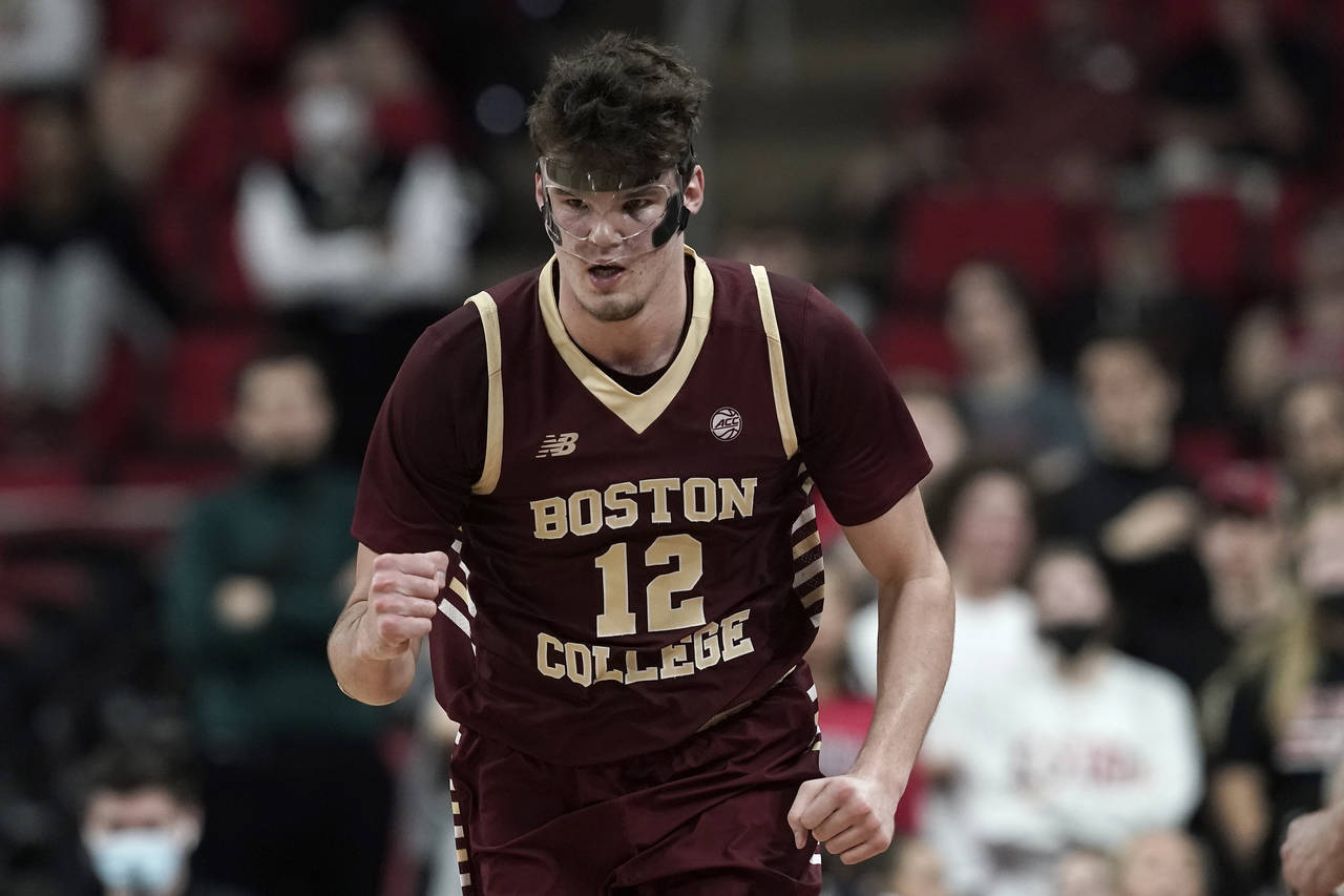 Boston College forward Quinten Post (12) pumps a fist following a basket during the second half of ...