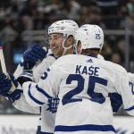 
              Toronto Maple Leafs left wing Michael Bunting, left, and right wing Ondrej Kase celebrate a power play goal during the first period of an NHL hockey game against the Seattle Kraken, Monday, Feb. 14, 2022, in Seattle. (AP Photo/Stephen Brashear)
            