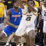 
              Missouri's Kaleb Brown, right, chases down a loose ball in front of Florida's CJ Felder, left, during the first half of an NCAA college basketball game Wednesday, Feb. 2, 2022, in Columbia, Mo. (AP Photo/L.G. Patterson)
            