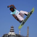 
              Ekaterina Kosova of the Russian Olympic Committee competes during the women's snowboard big air qualifications of the 2022 Winter Olympics, Monday, Feb. 14, 2022, in Beijing. (AP Photo/Ashley Landis)
            