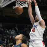 
              Los Angeles Clippers center Ivica Zubac (40) dunks against Dallas Mavericks guard Jalen Brunson (13) during the first quarter of an NBA basketball game in Dallas, Saturday, Feb. 12, 2022. (AP Photo/LM Otero)
            