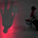 
              Workers repair the ice before the men's free skate program during the figure skating event at the 2022 Winter Olympics, Thursday, Feb. 10, 2022, in Beijing. (AP Photo/Jae C. Hong)
            