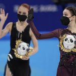 
              Gold medalist Anna Shcherbakova, right, of the Russian Olympic Committee,waves as she walks with silver medalist and compatriot Alexandra Trusova, left, following the women's free skate program during the figure skating competition at the 2022 Winter Olympics, Thursday, Feb. 17, 2022, in Beijing. (AP Photo/David J. Phillip)
            