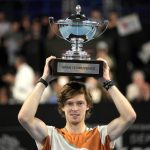 
              Andrey Rublev of Russia celebrates with the trophy after winning the men's singles final of the Open 13 Provence tennis tournament against Felix Auger-Aliassime of Canada in Marseille, south of France, Sunday, Feb.20, 2022. (AP Photo/Daniel Cole)
            
