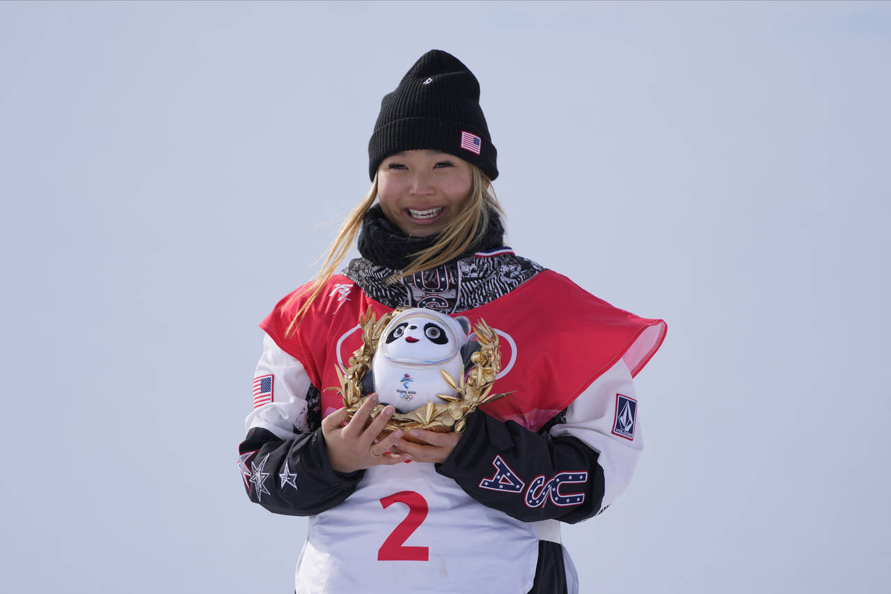 Gold medal winner United States' Chloe Kim celebrates during the venue ceremony for the women's hal...