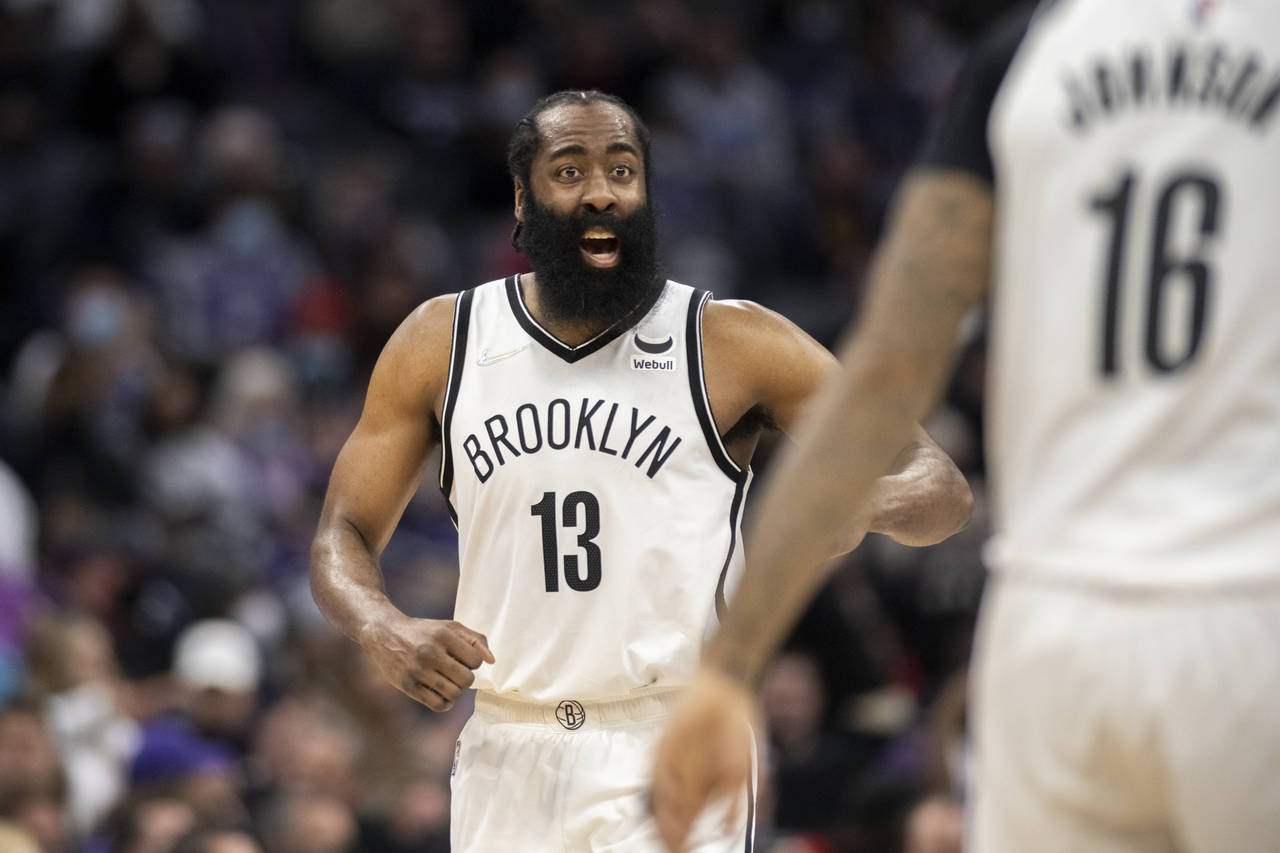 Brooklyn Nets guard James Harden (13) yells to forward James Johnson (16) during the second half of...