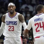 
              Los Angeles Clippers' Robert Covington, left, is congratulated by forward Norman Powell after scoring and drawing a foul during the second half of an NBA basketball game against the Milwaukee Bucks Sunday, Feb. 6, 2022, in Los Angeles. (AP Photo/Mark J. Terrill)
            