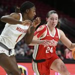 
              Ohio State's Taylor Mikesell, right, drives to the basket as Maryland's Diamond Miller defends in the first half of an NCAA college basketball game Thursday, Feb. 17, 2022, in College Park, Md. (AP Photo/Gail Burton)
            