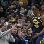 
              Indiana Pacers forward Jalen Smith (25) reacts after hitting a 3-point basket during the second half of an NBA basketball game against the Boston Celtics, Sunday, Feb. 27, 2022, in Indianapolis. (AP Photo/Darron Cummings)
            