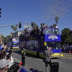 
              Confetti flies as buses carrying Los Angeles Rams players and coaches drive past fans during the team's victory parade in Los Angeles, Wednesday, Feb. 16, 2022, following their win Sunday over the Cincinnati Bengals in the NFL Super Bowl 56 football game. (AP Photo/Marcio Jose Sanchez)
            