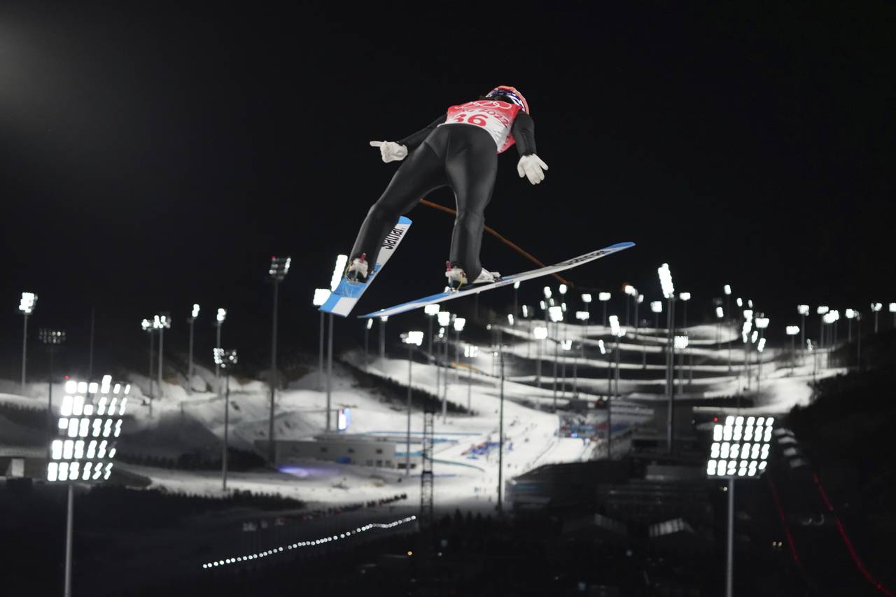 Sara Takanashi, of Japan, soars through the air during the women's normal hill individual ski jumpi...
