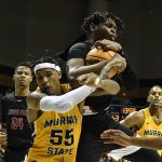
              Murray State forward DJ Burns (55) battles Austin Peay center Elijah Hutchins-Everett, top, for a rebound during the second half of an NCAA college basketball game in Murray, Ky., Thursday, Feb. 17, 2022. (AP Photo/Timothy D. Easley)
            