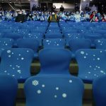 
              Spectators watch the pre-show ahead of the opening ceremony of the 2022 Winter Olympics, Friday, Feb. 4, 2022, in Beijing. (AP Photo/Jae C. Hong)
            