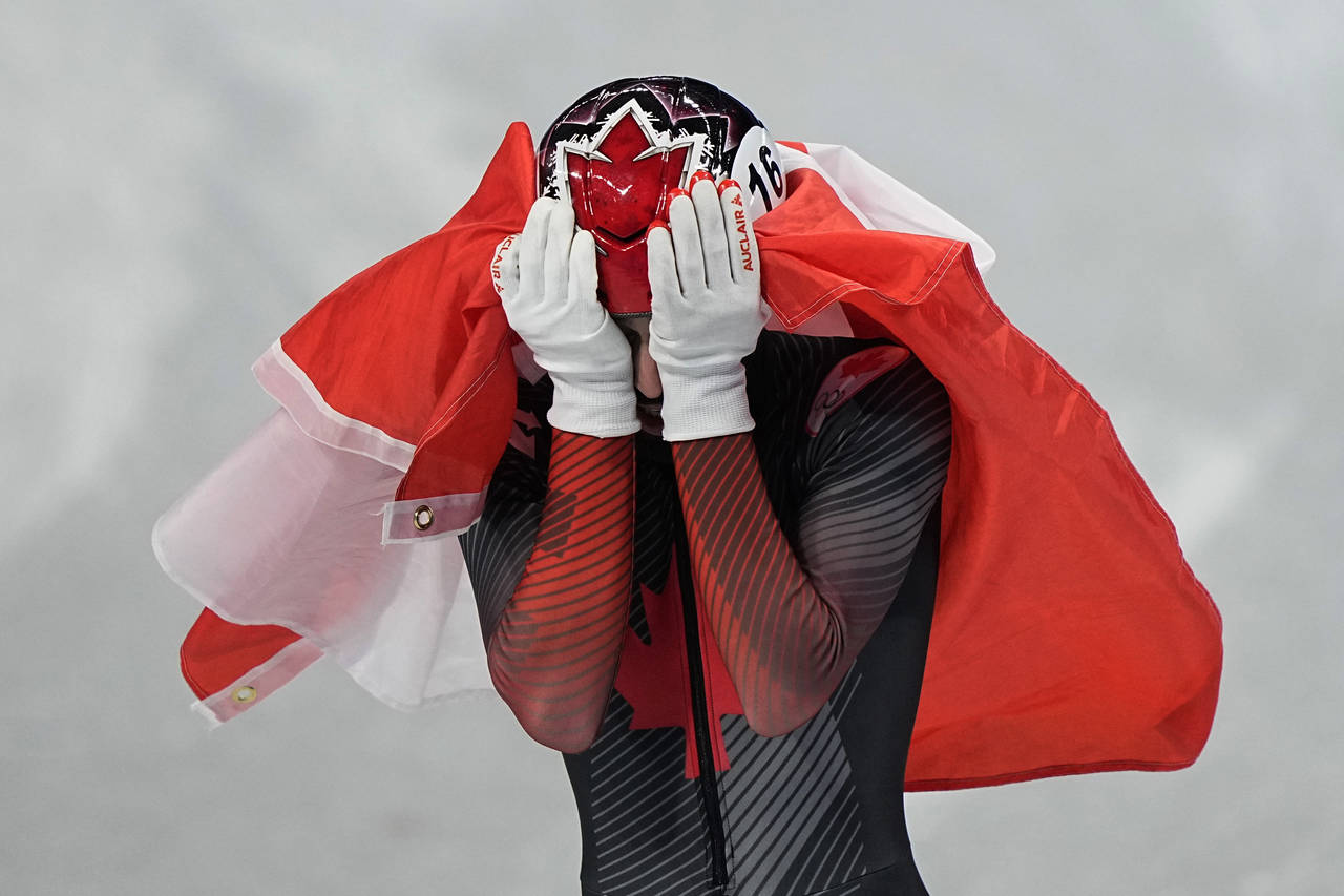 Steven Dubois of Canada, reacts after his second place finish in the men's 1500-meters final during...